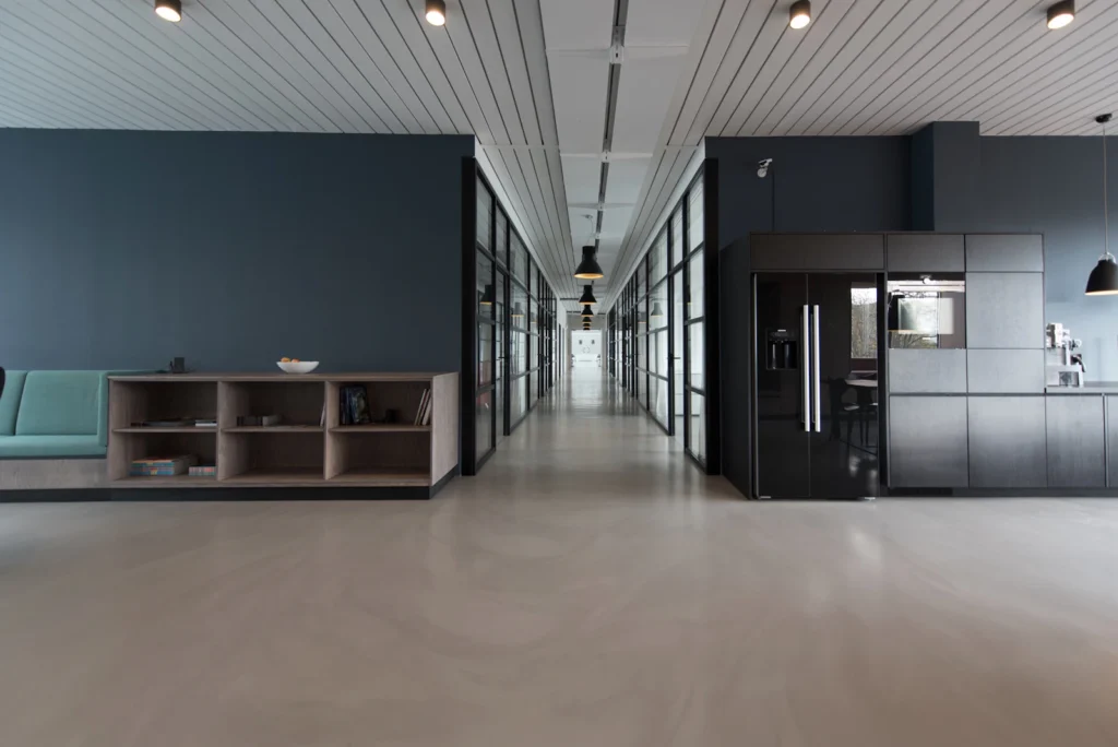 Empty open-plan commercial office floor with polished concrete