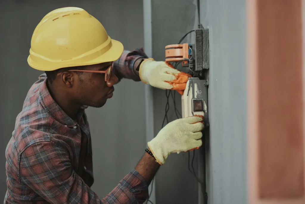 Electrician working in a panel