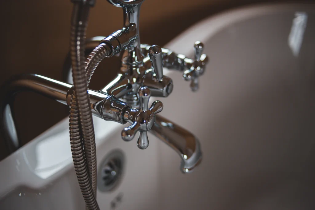 Close-up of a chrome kitchen faucet and sink